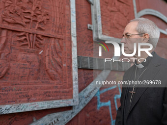 The Archbishop of Canterbury, Justin Welby during his visit to Belfast stops at the Peace Wall. Belfast, Nortern Ireland. 2nd October 2014....