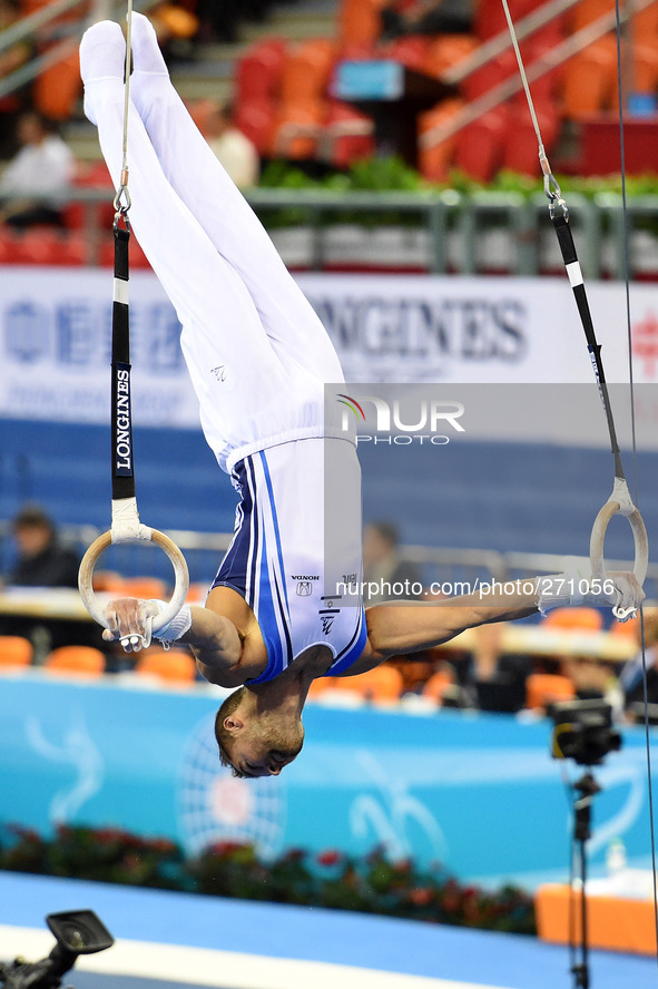 (141003) -- NANNING, Oct. 3, 2014 () -- Alexander Shatilov from Israel performs on the rings during the men's qualifying round of the 45th G...