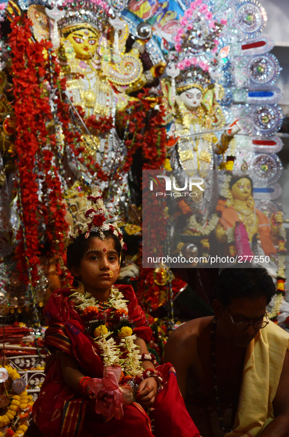 Members of aristocratic house (Banedi Bari) performing the rituals Kumari Puja . where unmarried young female children are being worshiped a...