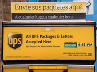 A United Parcel Service of America truck and drop-off box are seen along Milwaukee Avenue in the Old Irving Park neighborhood of Chicago, IL...