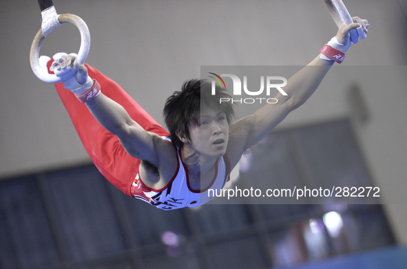 (141009) -- NANNING, Oct. 9, 2014 () -- Kohei Uchimura of Japan performs on the rings during the men's all-around final of the 45th Gymnasti...
