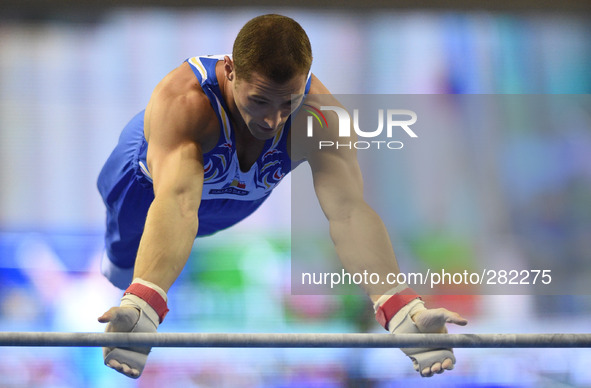 (141009) -- NANNING, Oct. 9, 2014 () -- Cristian Ioan Bataga of Romania performs on the horizontal bar during the men's all-around final of...