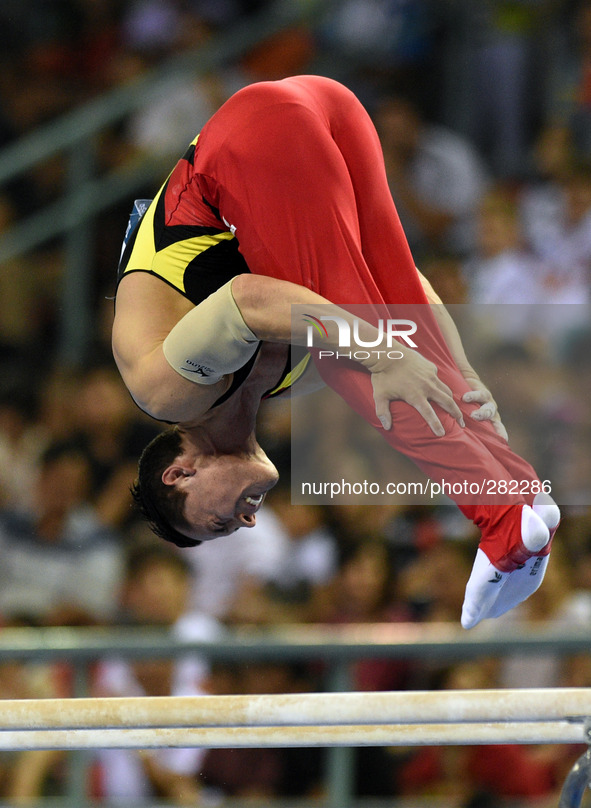 (141009) -- NANNING, Oct. 9, 2014 () -- German gymnast Andreas Toba performs on the parallel bars during the men's all-around final of the 4...