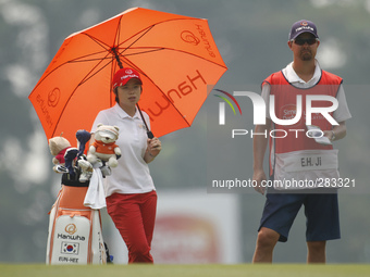 Ji Eun-Hee waits for her turn on the fairway of hole 9 during the second round of the LPGA Malaysia golf tournament at Kuala Lumpur Golf and...