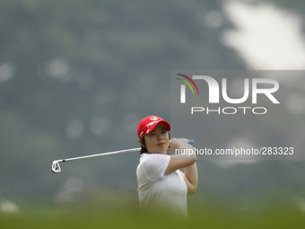 Ji Eun-Hee watches her shot on the fairway of hole 9 during the second round of the LPGA Malaysia golf tournament at Kuala Lumpur Golf and C...