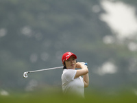 Ji Eun-Hee watches her shot on the fairway of hole 9 during the second round of the LPGA Malaysia golf tournament at Kuala Lumpur Golf and C...