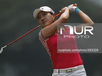 Hee Young Park of Korea watches her  shot from the fairway of hole 9 during the second round of the LPGA Malaysia golf tournament at Kuala L...