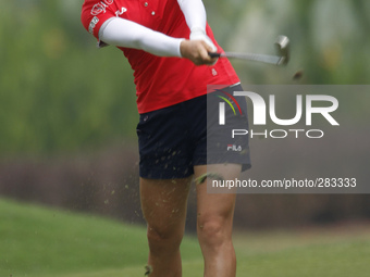 So Yeon Ryu of South Korea hits her second shot from the fairway of hole 10 during the second round of the LPGA Malaysia golf tournament at...