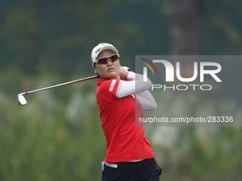 So Yeon Ryu of South Korea watches her second shot from the fairway of hole 10 during the second round of the LPGA Malaysia golf tournament...