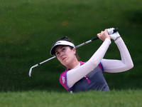 Sandra Gal of Germany watches her second shot from the bunker of hole eighteenth during the third round of the LPGA Malaysia golf tournament...