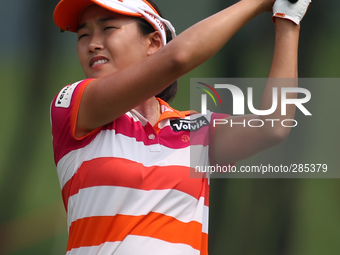 Ilhee Lee of South Korea watches her second shot on the eighteenth hole during the third round of the LPGA Malaysia golf tournament at Kuala...