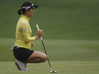 So Yeon Ryu of South Korea lines up a putt on the green of hole eight during the fourth round of the LPGA Malaysia golf tournament at Kuala...