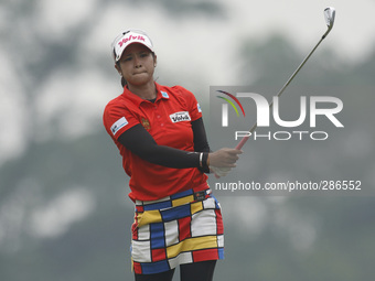 Pornanong Phatlum of Thailand watches her second shot on the hole nine during the fourth round of the LPGA Malaysia golf tournament at Kuala...