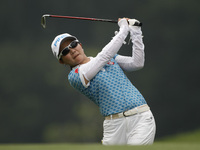 Ayaka Uehara of Japan watches her second shot on the fairway of hole nine during the fourth round of the LPGA Malaysia golf tournament at Ku...