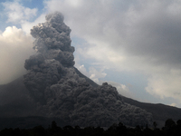 Mount Sinabung volcano with lava blowing a giant black cloud of volcanic ash after the latest eruption of Mount Sinabung in Karo District, S...