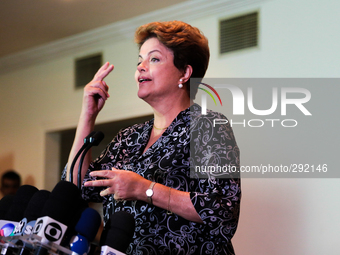 Brazil's President Dilma Rousseff, presidential candidate for re-election from the Workers Party (PT), speaks with journalists at a press co...