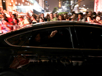 Brazil's President Dilma Rousseff, presidential candidate for re-election from the Workers Party (PT), waves from a car while leaving a meet...