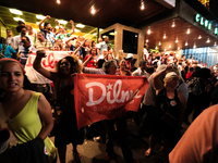 Supporters of the Brazil's President Dilma Rousseff, presidential candidate for re-election from the Workers Party (PT), shout slogans in fa...