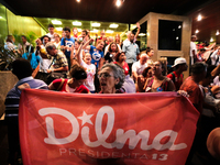 Supporters of the Brazil's President Dilma Rousseff, presidential candidate for re-election from the Workers Party (PT), shout slogans in fa...