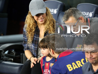 Colombian singer Shakira and her son Milan sit before the Spanish league football match FC Barcelona vs Eibar at the Camp Nou stadium in Bar...