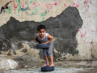 Palestinian children play in the al-Shati refugee camp in Gaza City, on October 19, 2014. The camp located along the Mediterranean Sea coast...