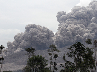 Sinabung volcano with lava blowing a giant black cloud of volcanic ash after the eruption launched the latest in Karo, Sumatra, Indonesia Oc...