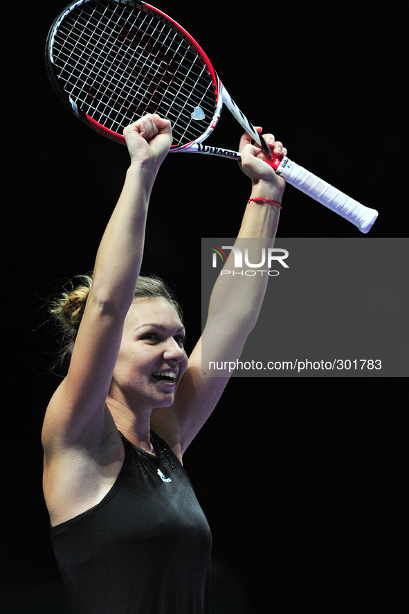 (141022) -- SINGAPORE, Oct. 22, 2014 () -- Romania's Simona Halep celebrates after winning the round robin match of the WTA Finals against S...