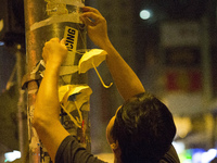 Pro-Democracy protester hangs an paper made umbrella in Mongkok, Kowloon, Hong Kong on Oct. 25 2014. Pro-Democracy protesters plan a referen...