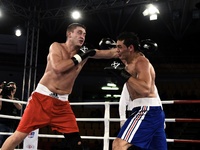 Anton Pinchuk (L) beats Yamil Peralta during Aiba matches in Rome, on October 24, 2014. (