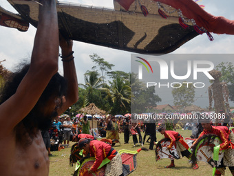 Performers action in a traditional art performance known as “Cowongan” and “Kuda Lumping” in Karanglewas, Banyumas, Central Java, Indonesia,...