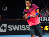 Borna Coric (CRO) returns the ball with a backhand during the semi final of the Swiss Indoors  at St. Jakobshalle in Basel, Switzerland on O...