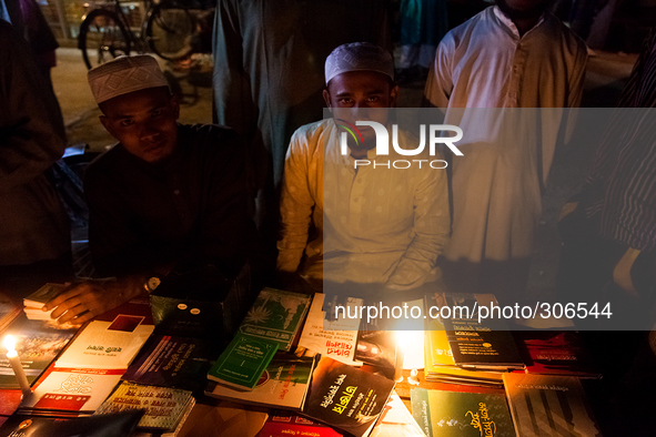 Young men set up a small book stall to sell Islamic books to the Muslims. 