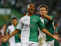 Sporting's midfielder Joao Mario (L) celebrates his goal (2-0) with Sporting's midfielder Adrien Silva (R)  during the Portuguese League  fo...