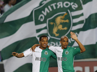 Sporting's forward Andre Carrillo (L) and Sporting's midfielder Joao Mario (R) celebrate the first goal for Sportingduring the Portuguese Le...