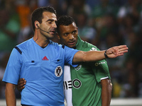 Sporting´s forward Nani (R) speaks with referee Manuel Oliveira during the Portuguese League football match between Sporting CP and CS Marit...