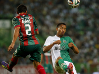 Sporting's forward Andre Carrillo (R) heads for the ball with Maritimo's defender Joao Diogo (L)  during the Portuguese League  football mat...
