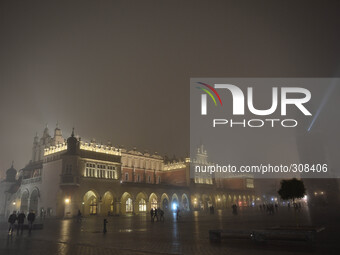 'A foggy evening in Krakow' - A view of Cloth Hall and Town Hall Tower, 26th October 2014, Photo credit: Artur Widak/NurPhoto (