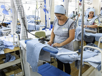 People at work in a factory for fabric tailoring, in Skvyra, Ukraine, on September 3, 2018. (