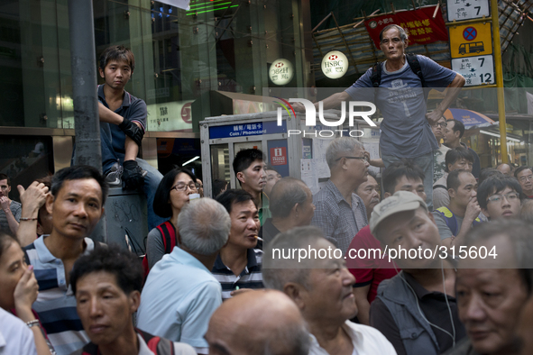 25th of October, 2015. Hong Kong, Kowloon district, Mong Kok. Curious citizens spend the time at the Mong kok occupation.  