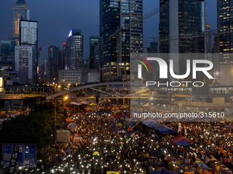 28th of October, 2015. Hong Kong, Hong Kong island, Admiralty. Crowd of protesters wave the mobile in Admiralty for peaceful rally. A large...