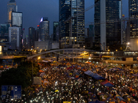 28th of October, 2015. Hong Kong, Hong Kong island, Admiralty. Crowd of protesters wave the mobile in Admiralty for peaceful rally. A large...