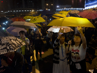 28th of October, 2015. Hong Kong, Hong Kong island, Admiralty. Pro-democracy protesters hold umbrellas as a symbol for disobedience and pro-...