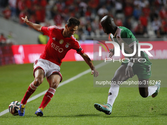 Benfica's forward Jonas (L) vies with Rio Ave's defender Prince (R) during the Portuguese League football match between SL Benfica and Rio A...