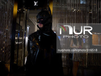 Hong Kong, Hong Kong Island, Central. 31st of October, 2014. A man dresses as Batman in Central district.  (