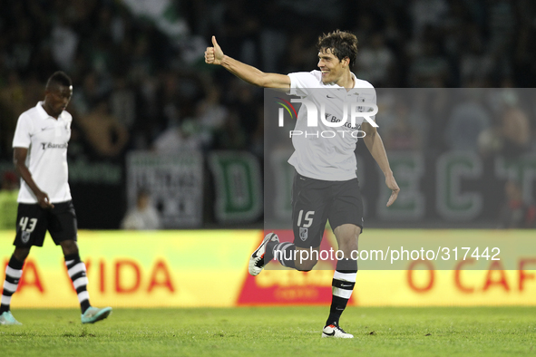 PORTUGAL, Guimarães: Vitoria SC's Portuguese defender João Afonso celebrates after scoring a goal during Premier League 2014/15 match betwee...