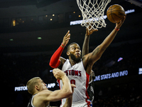 Detroit Pistons' Andre Drummond (0), makes a layup under the basket during the second half of the home opener against Brooklyn Nets, Saturda...