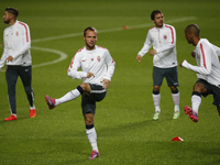 Monaco's players warm up during a training session on the eve of the Champions League football match opposing SL Benfica to AS Monaco  FC on...