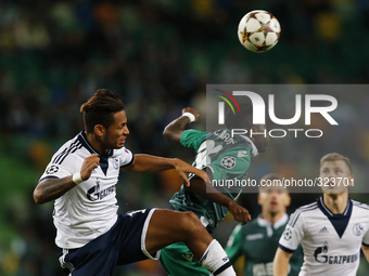 Schalke 04's defender Dennis Aogo (L) heads for the ball with Sporting's forward Carlos Mane (R)  during the UEFA Champions League  group G...