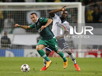 Sporting's defender Jefferson (L)  vies for the ball with Schalke 04's forward Chinedu Obasi (R)  during the UEFA Champions League  group G...