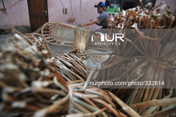 SUKOHARJO, INDONESIA - November 10: A workers seen making eco-friendly coffins in the village Trangsan, Sukoharjo, Central Java, Indonesia,...